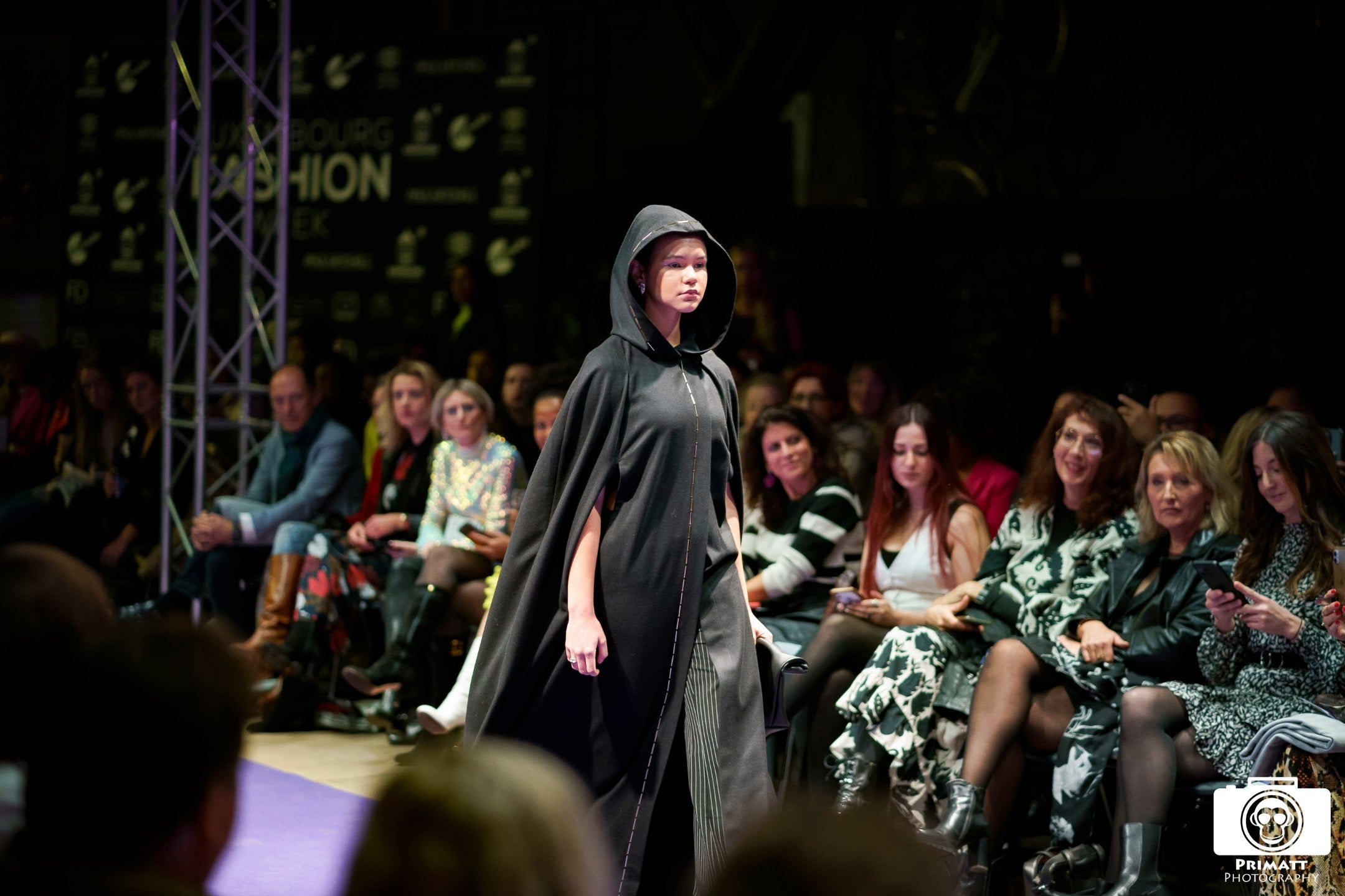 Full length black wool cape with golden crystal hem