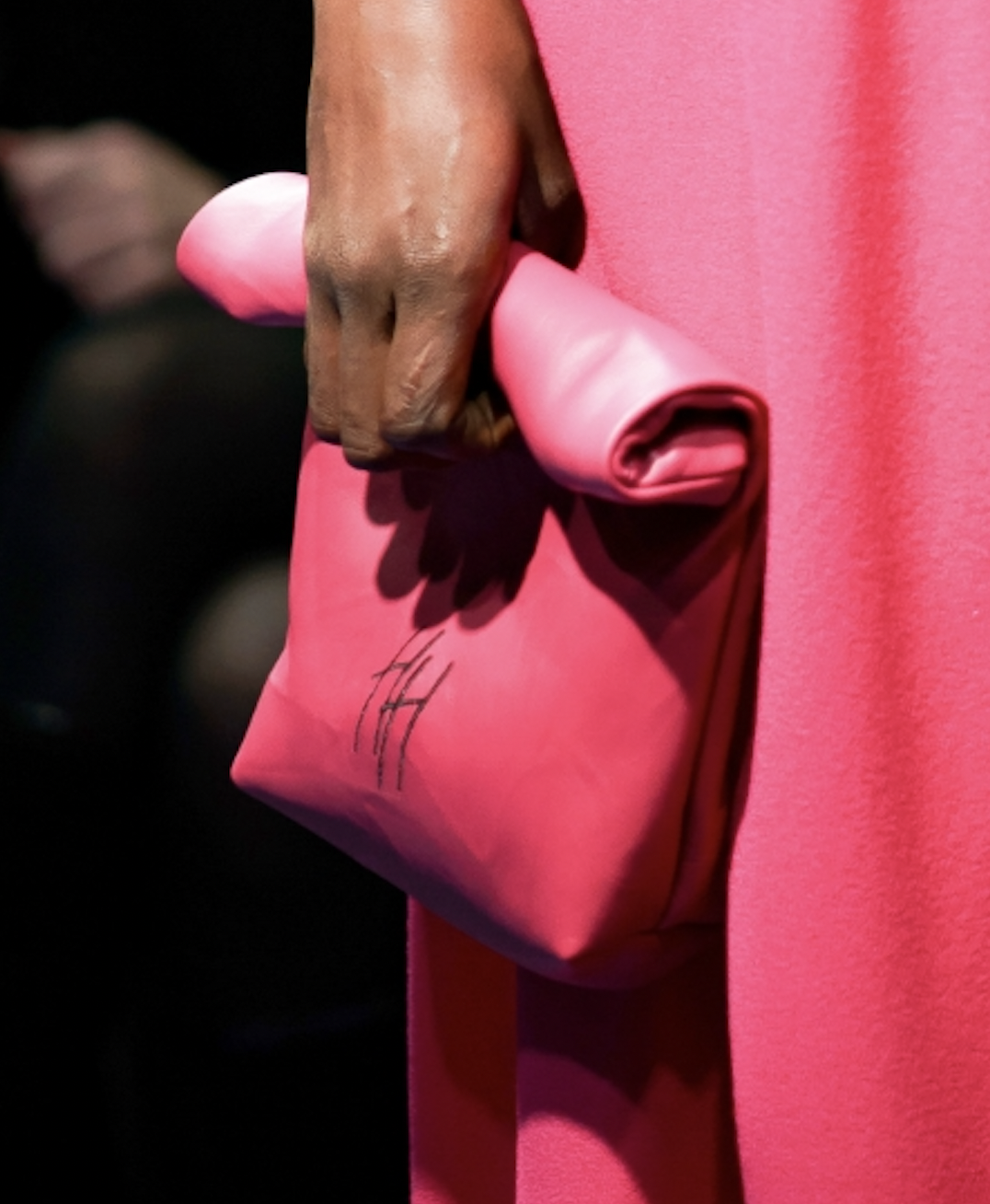 Pink leather clutch with HH embroidery